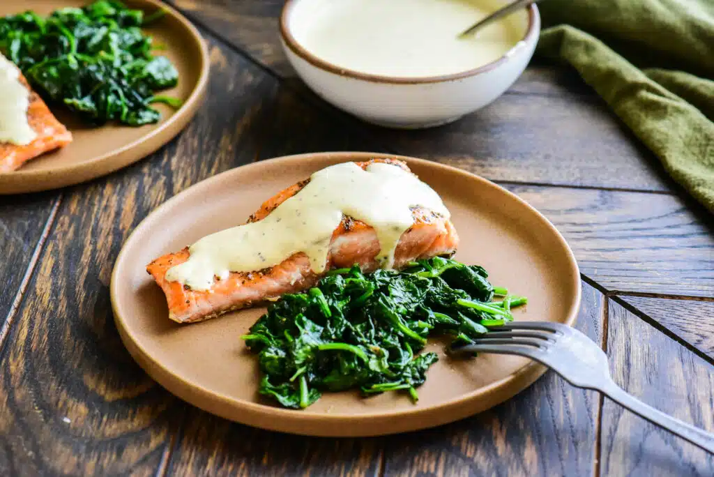 seared salmon and creamy mustard sauce served with sauteed spinach