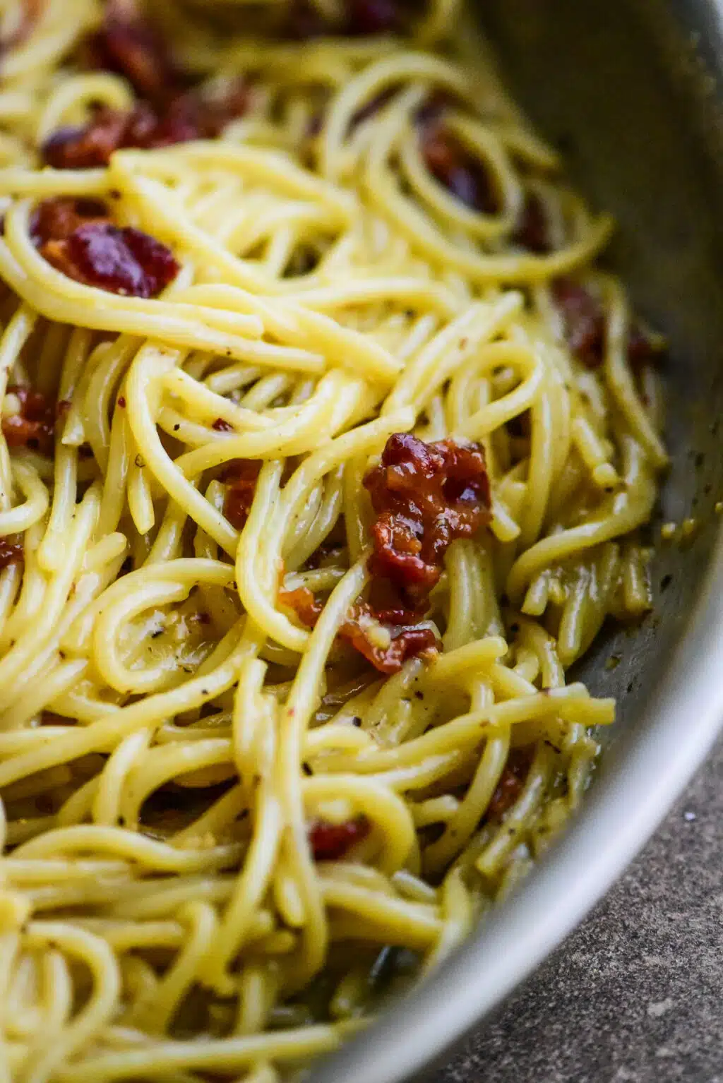 close up of spaghetti carbonara in a metal pan