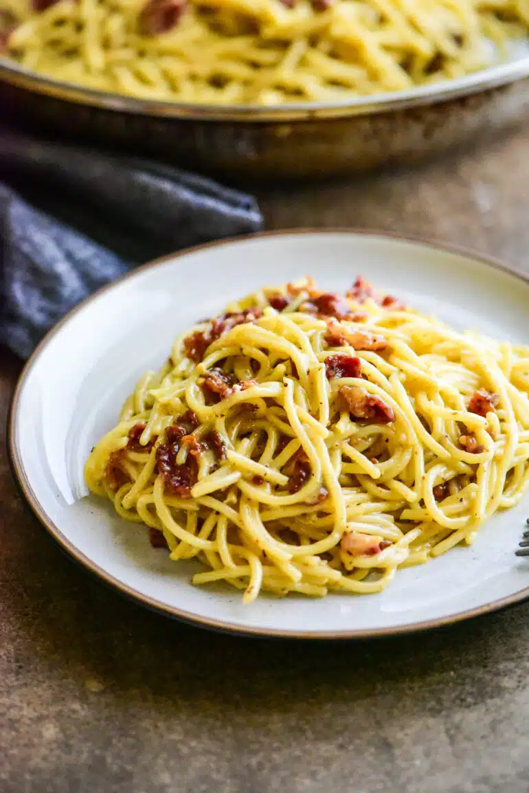 single serving of spaghetti carbonara on a small plate
