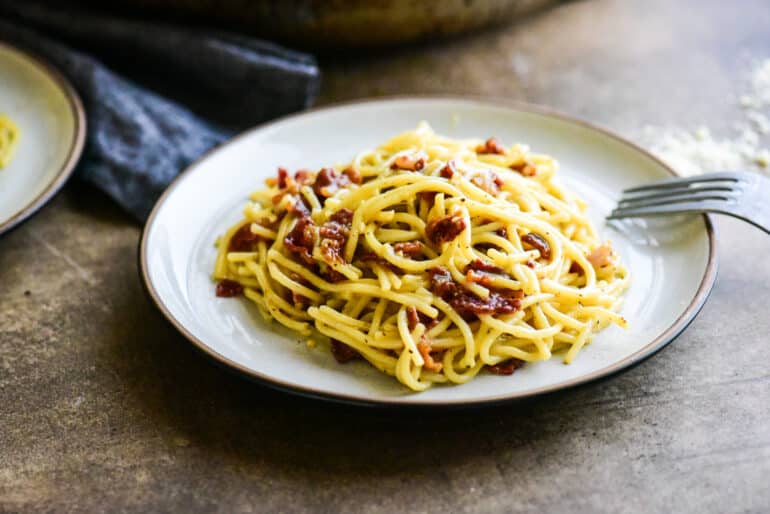 single serving of spaghetti carbonara on a small plate