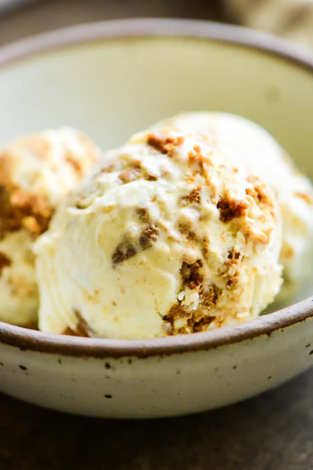three scoops of no-churn biscoff ice cream in a bowl 