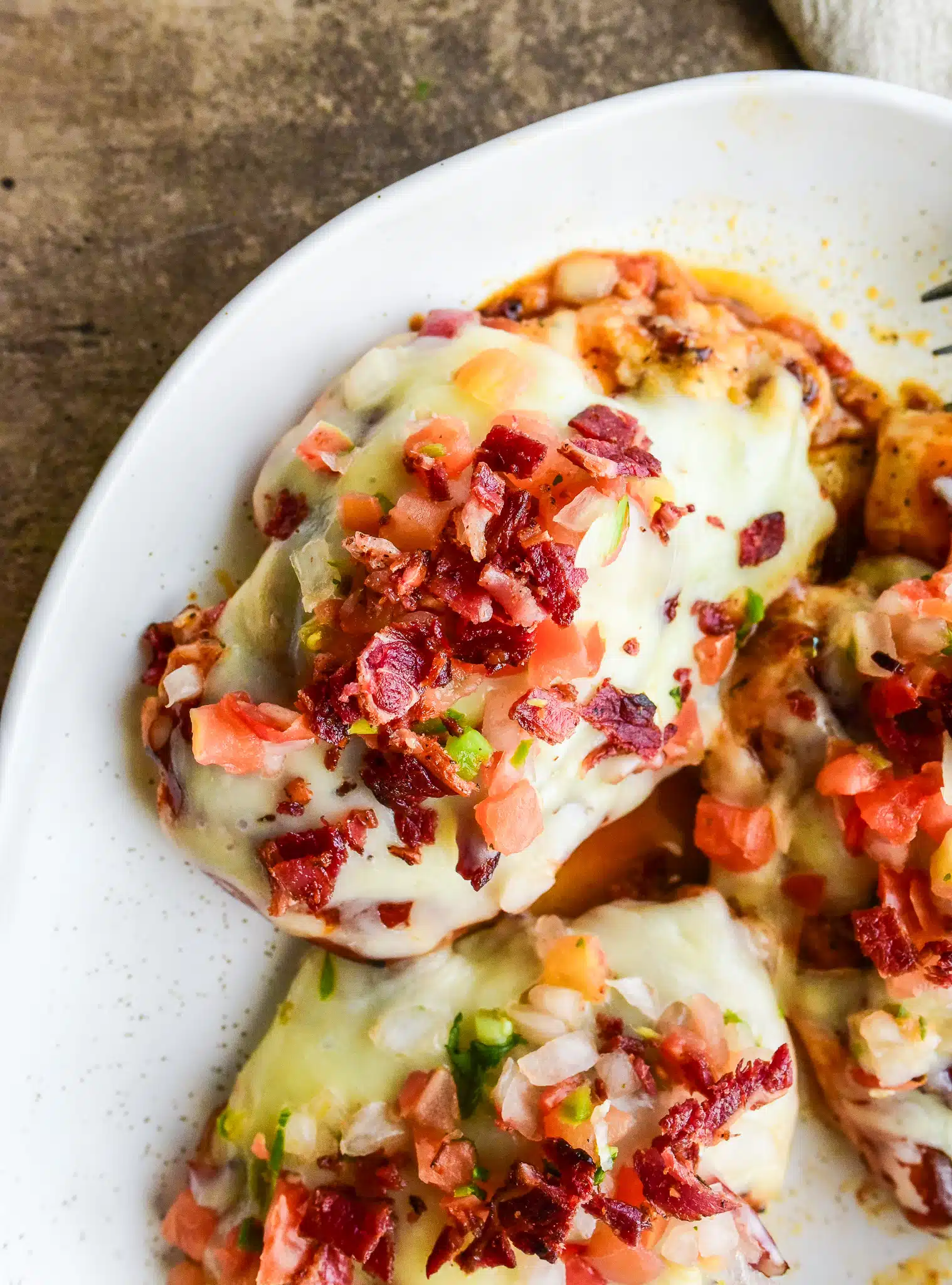 overhead shot of Monterey chicken on a white plate
