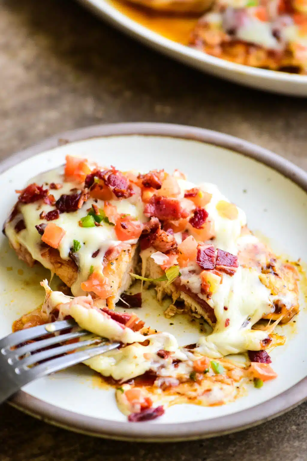 cutting into serving of Monterey chicken