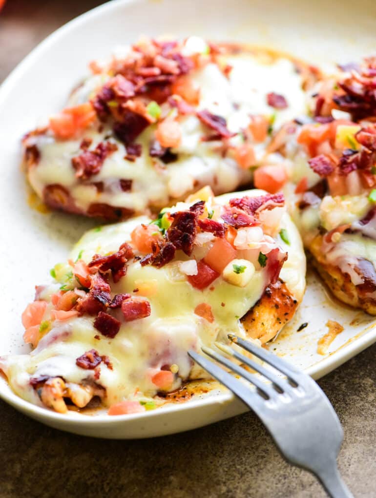 Monterey chicken served family stye on a large white plate