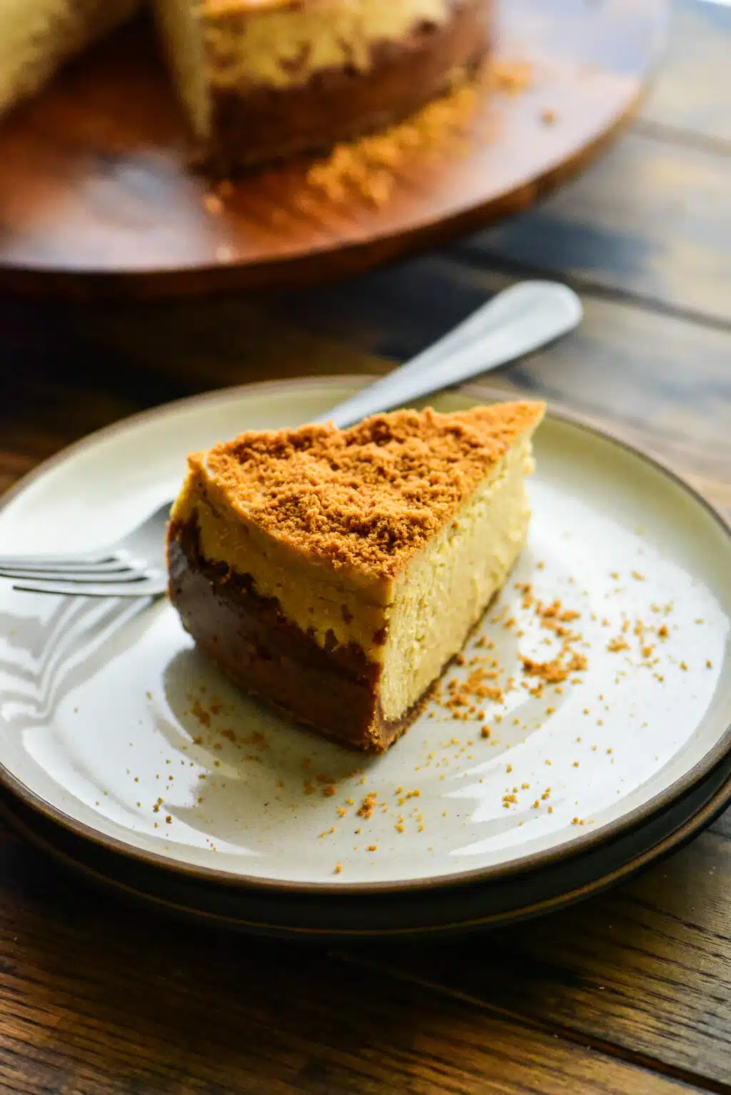 slice of biscoff cheesecake on a dessert plate with a fork