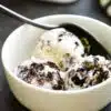 a single bowl with three scoops of no churn oreo ice cream
