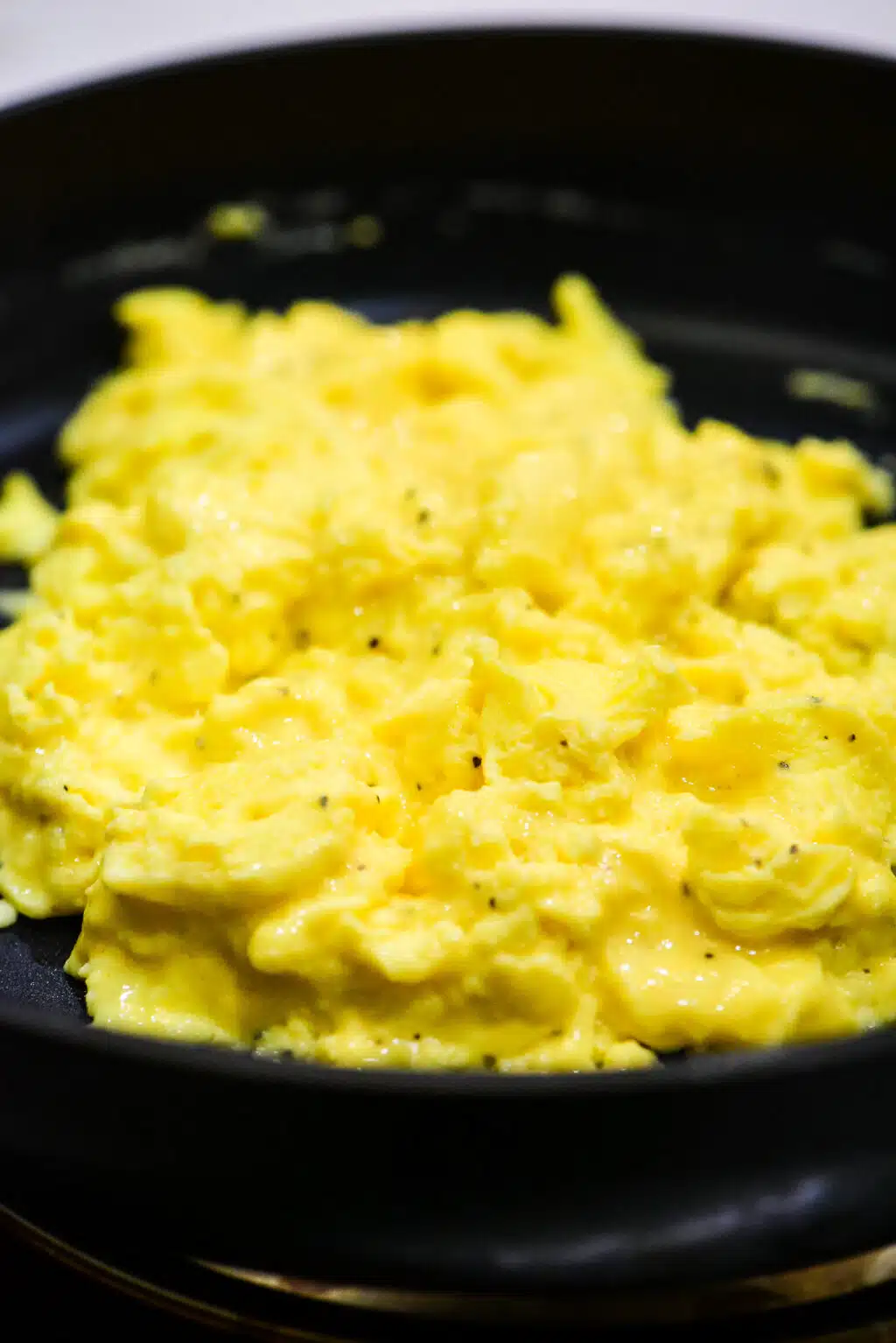 fluffy scrambled eggs in a skillet