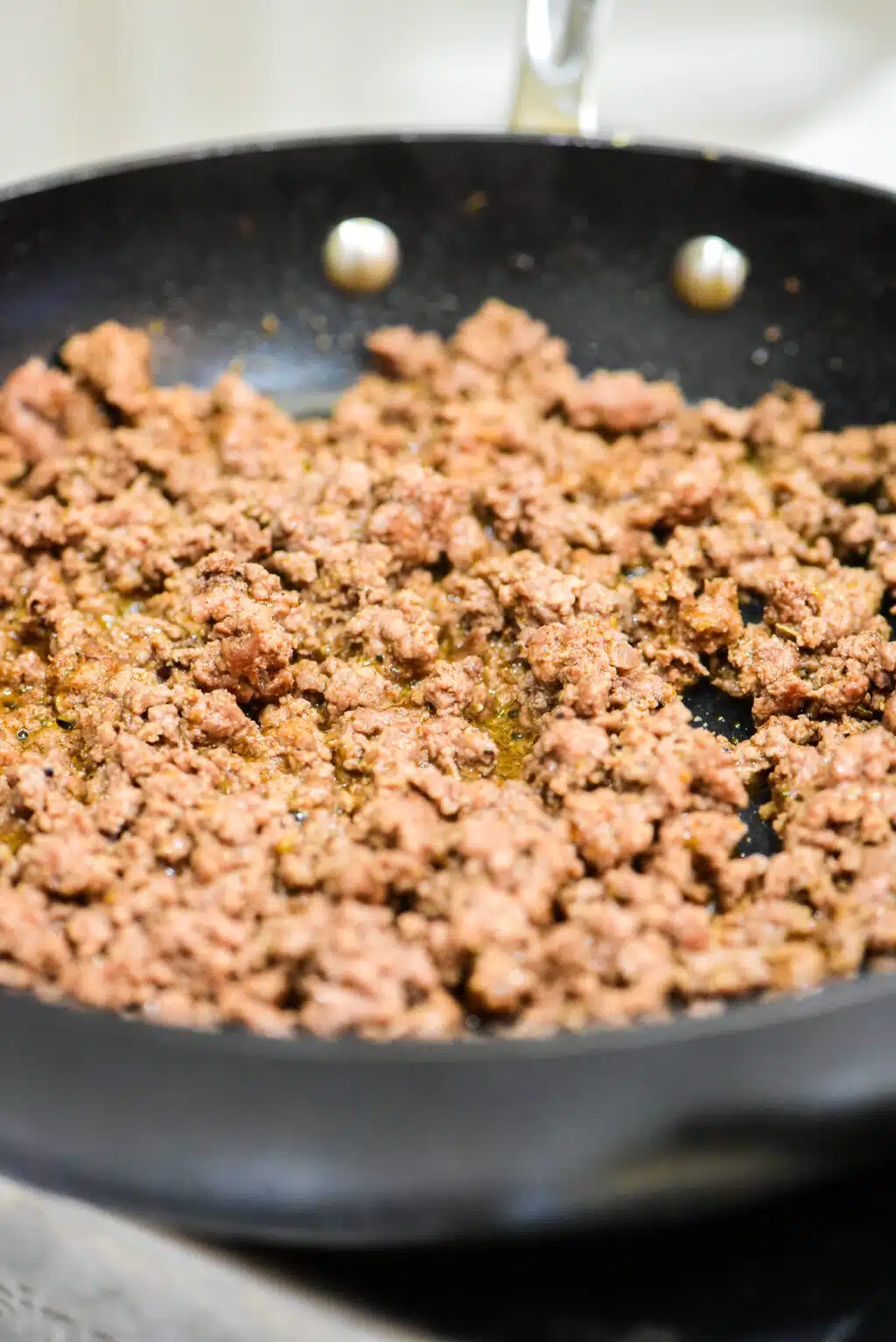 cooked ground beef in a skillet