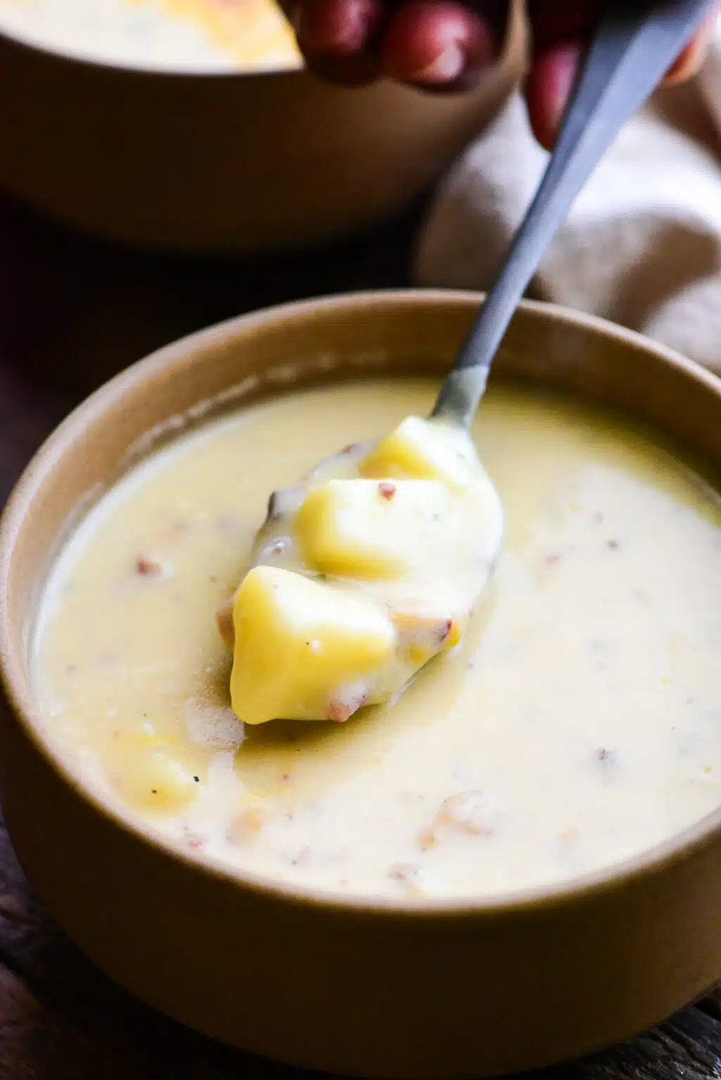 bowl of baked potato soup with chunks of tender potatoes