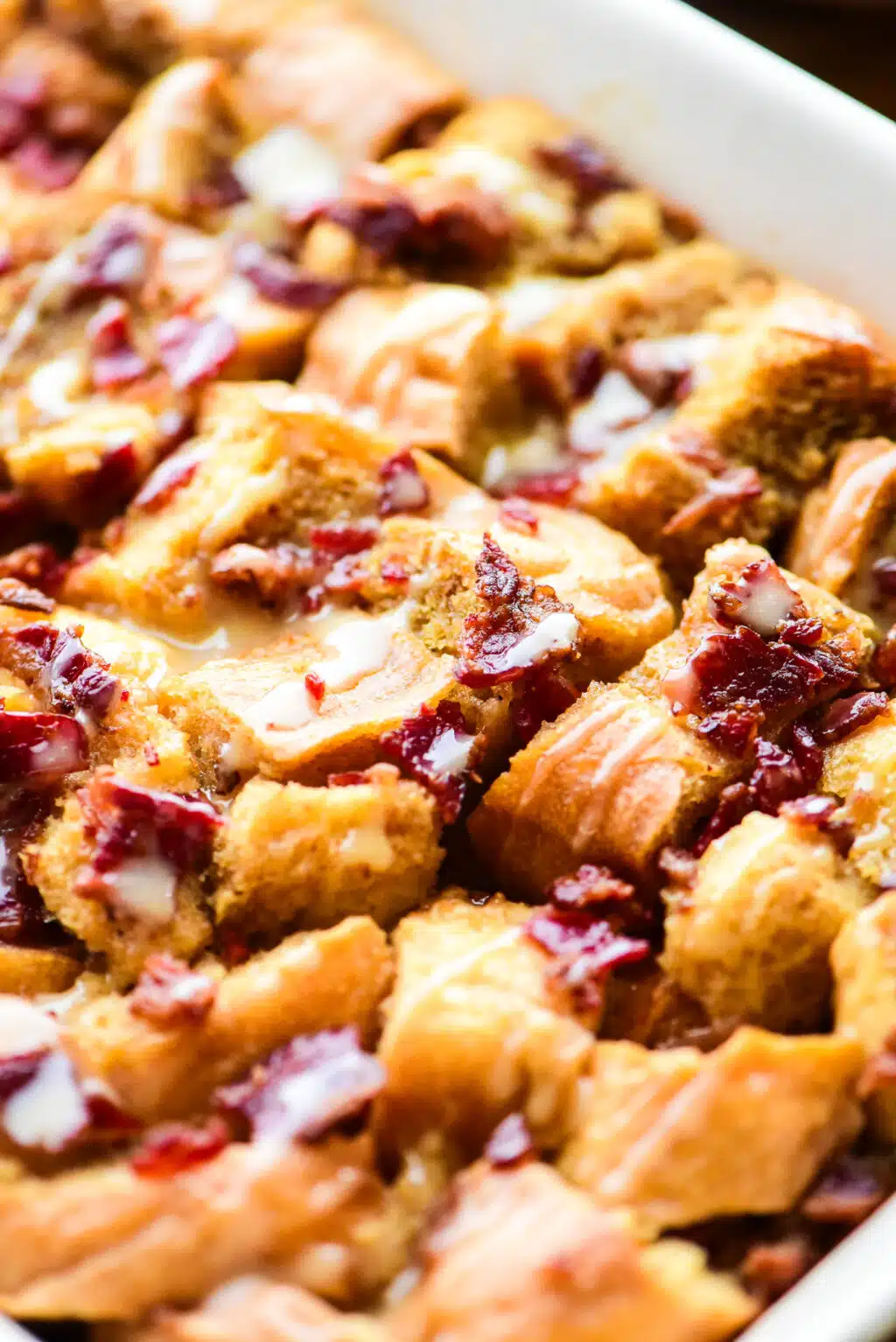 close up of maple bacon bread pudding in a casserole dish