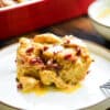individual serving of maple bacon bread pudding on a dessert plate