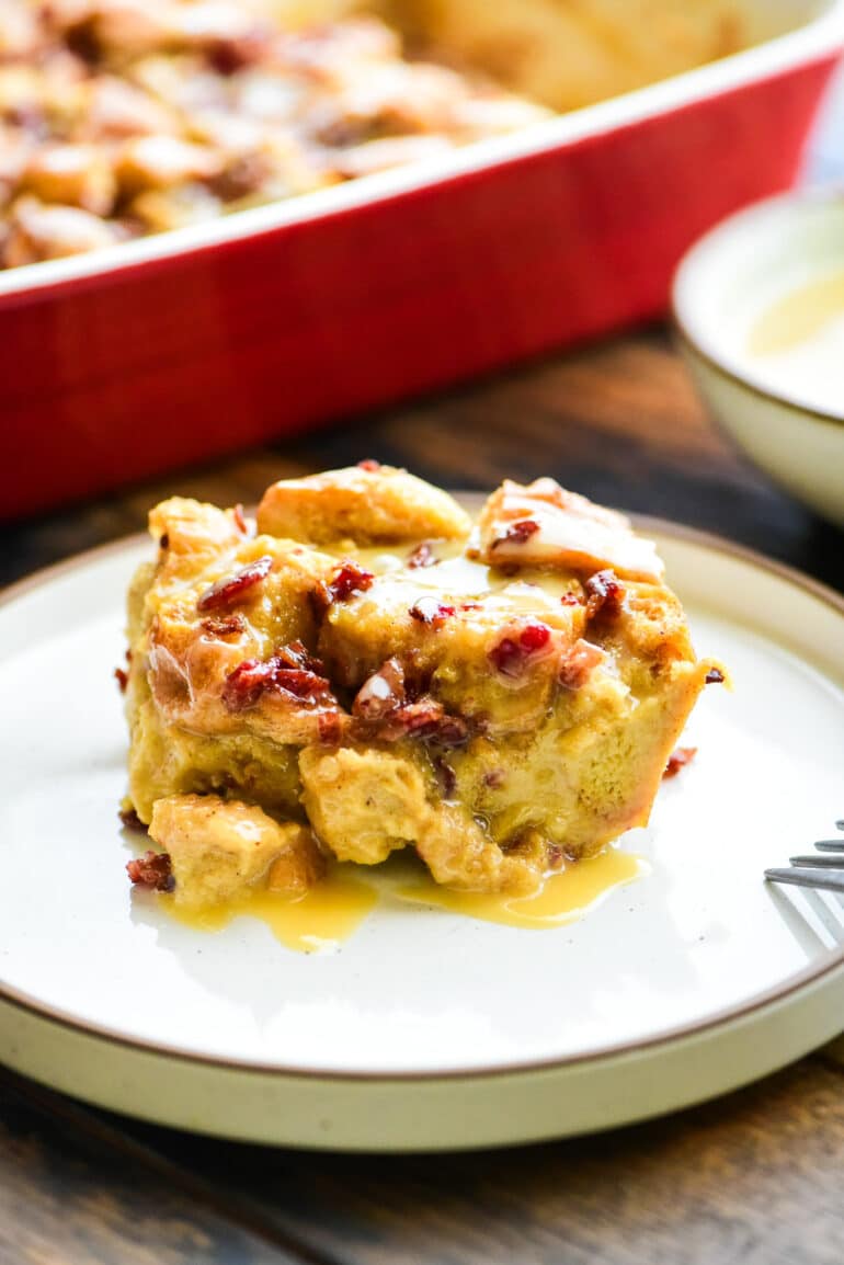 individual serving of maple bacon bread pudding on a dessert plate