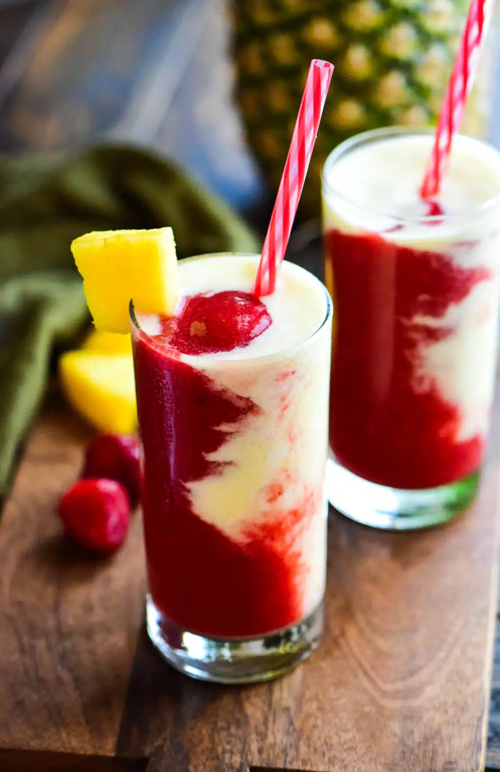 two frozen miami vice cocktails served with a straw