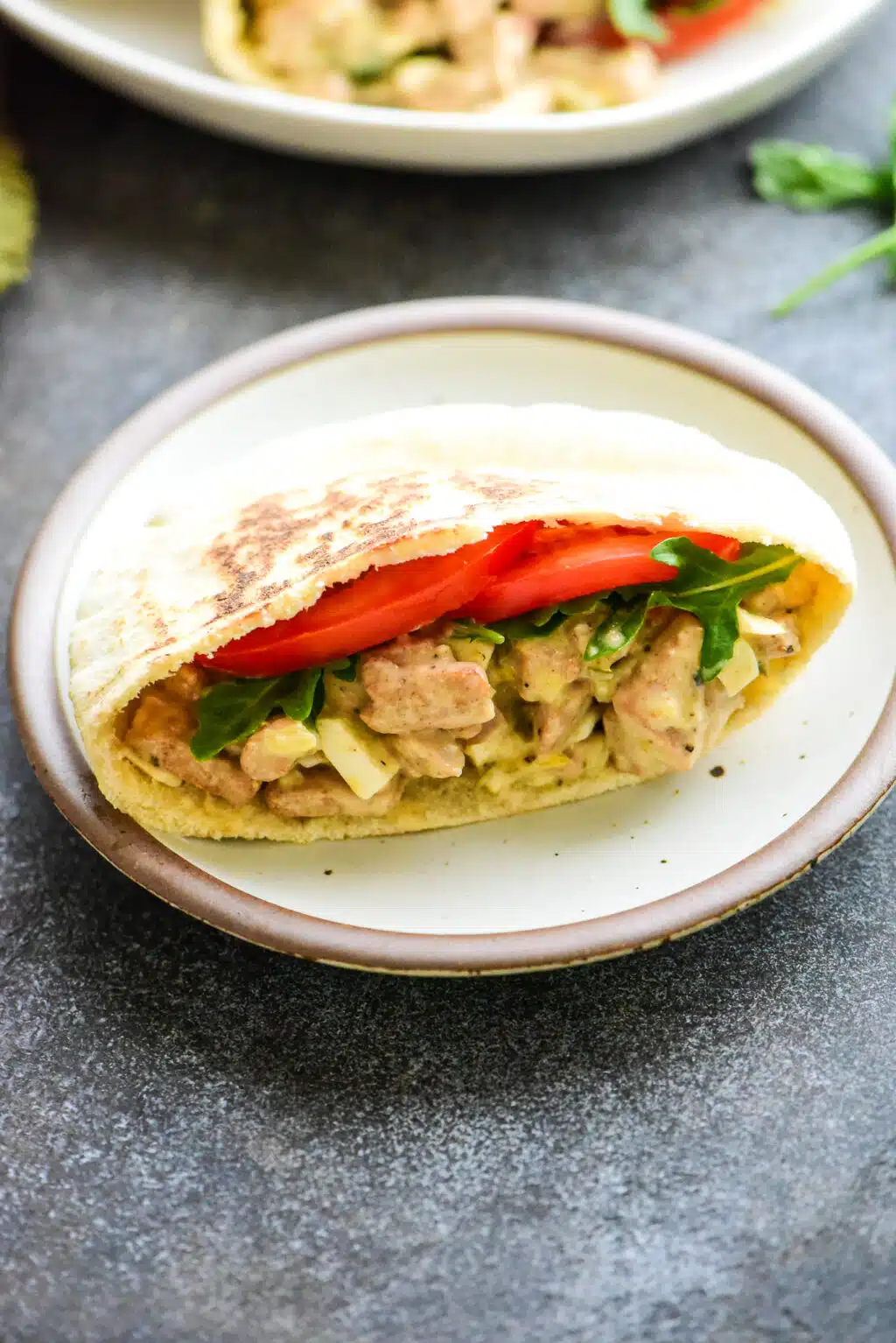 single tuna salad pita on a small plate
