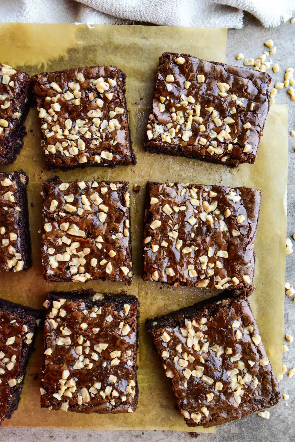 overhead shot of fudgy toffee brownies on parchment paper