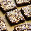 toffee brownies that have been cut into squares placed on brown parchment paper