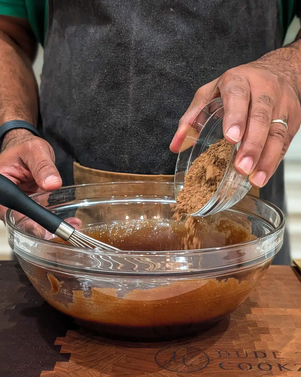 adding the unsweetened cocoa powder to the bowl.