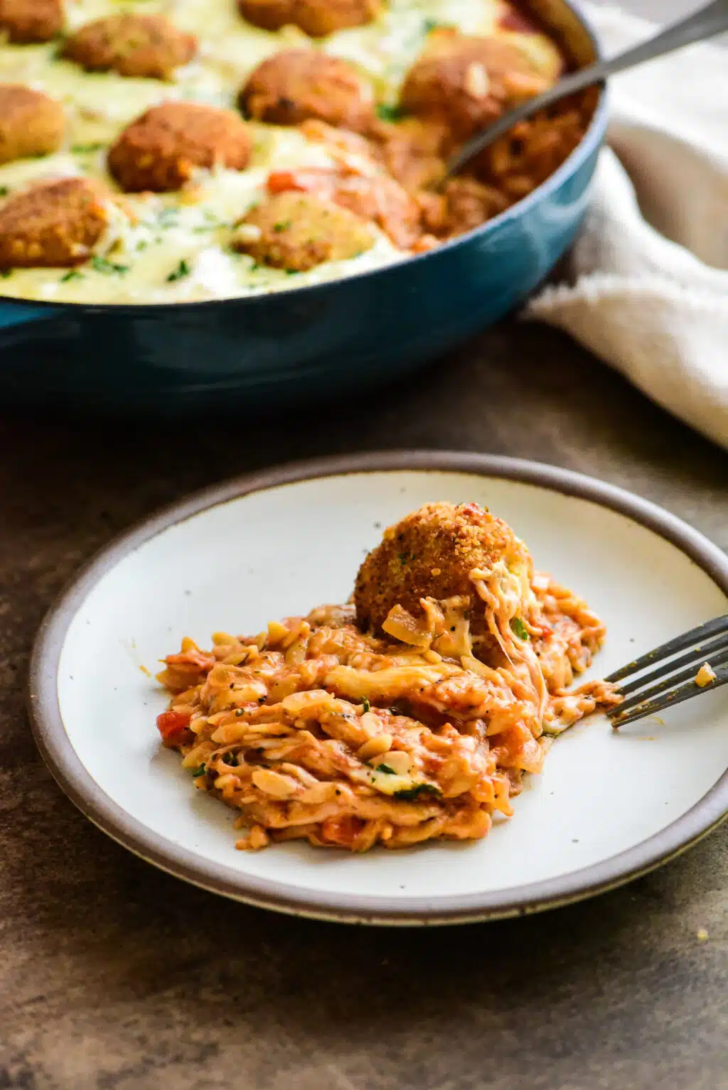 serving of chicken parm meatball orzo on a plate