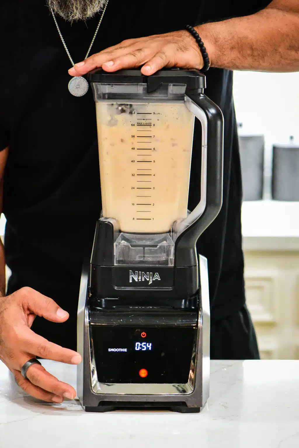 blending the puerto rican coquito cocktail ingredients in the blender