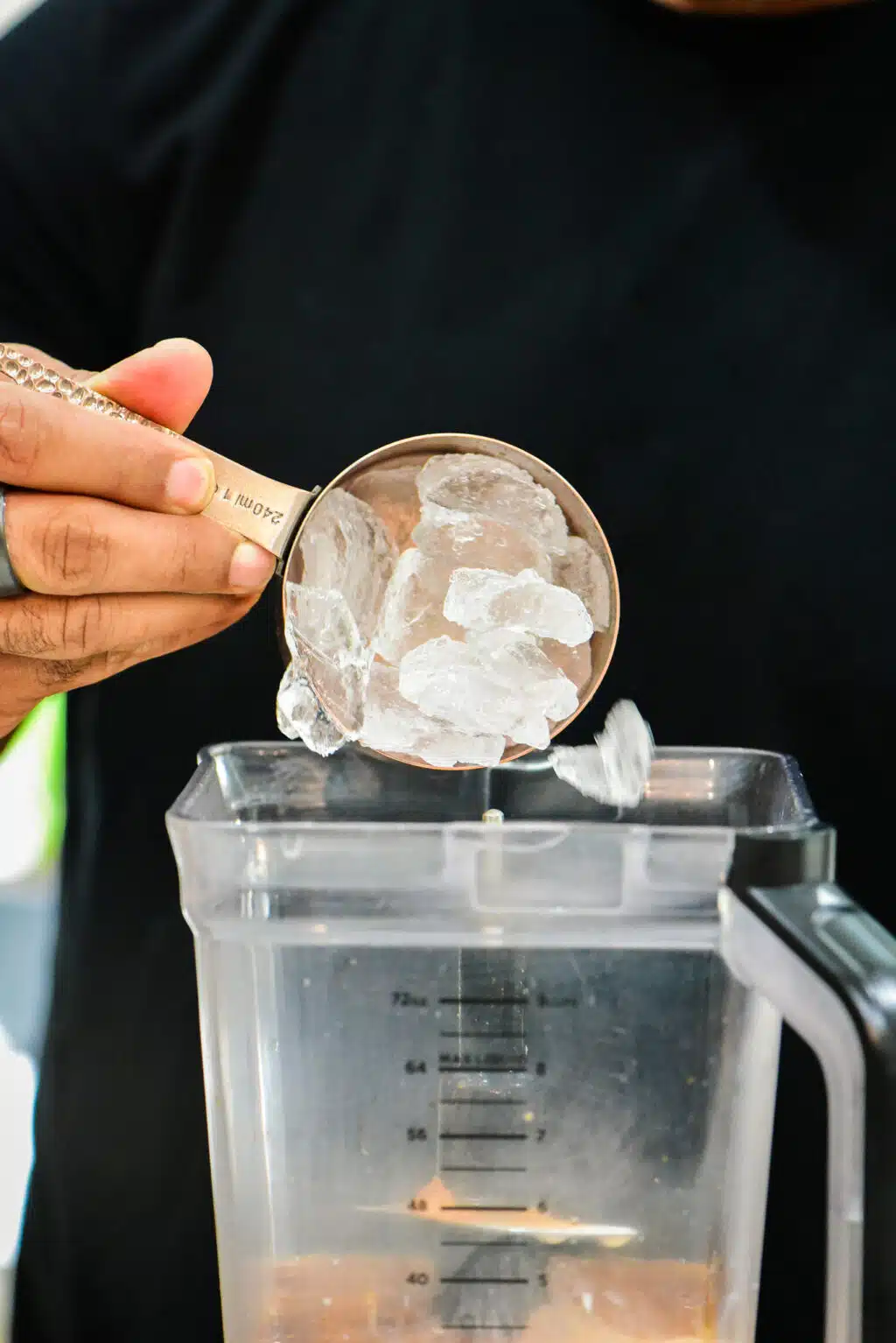 adding ice to the blender