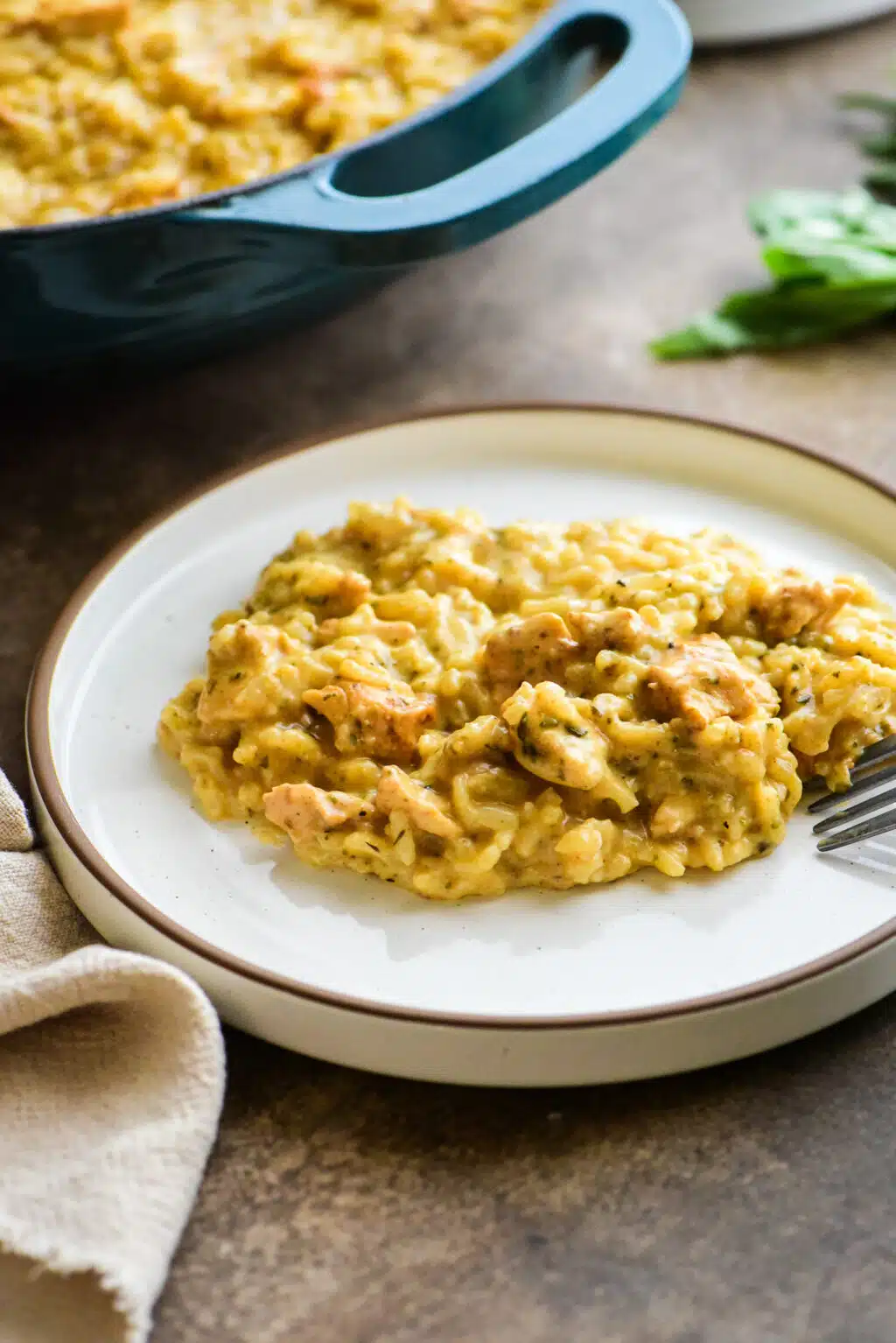 single serving of chicken and herb risotto on a plate