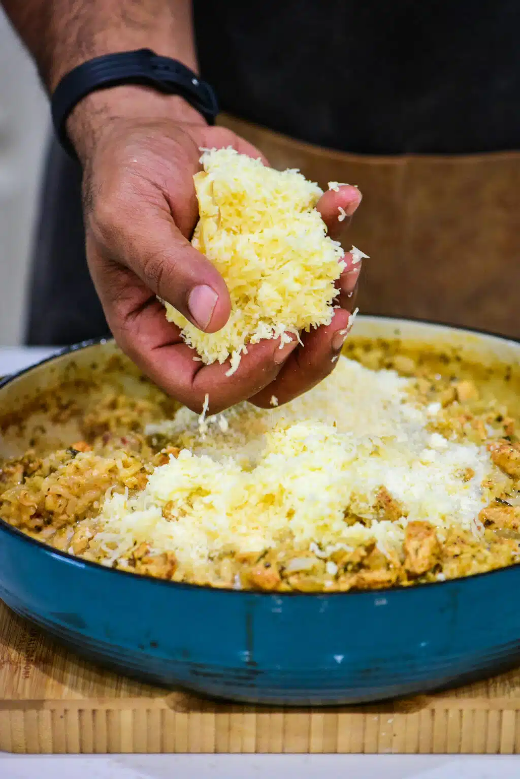 adding the cheese to the risotto to finish