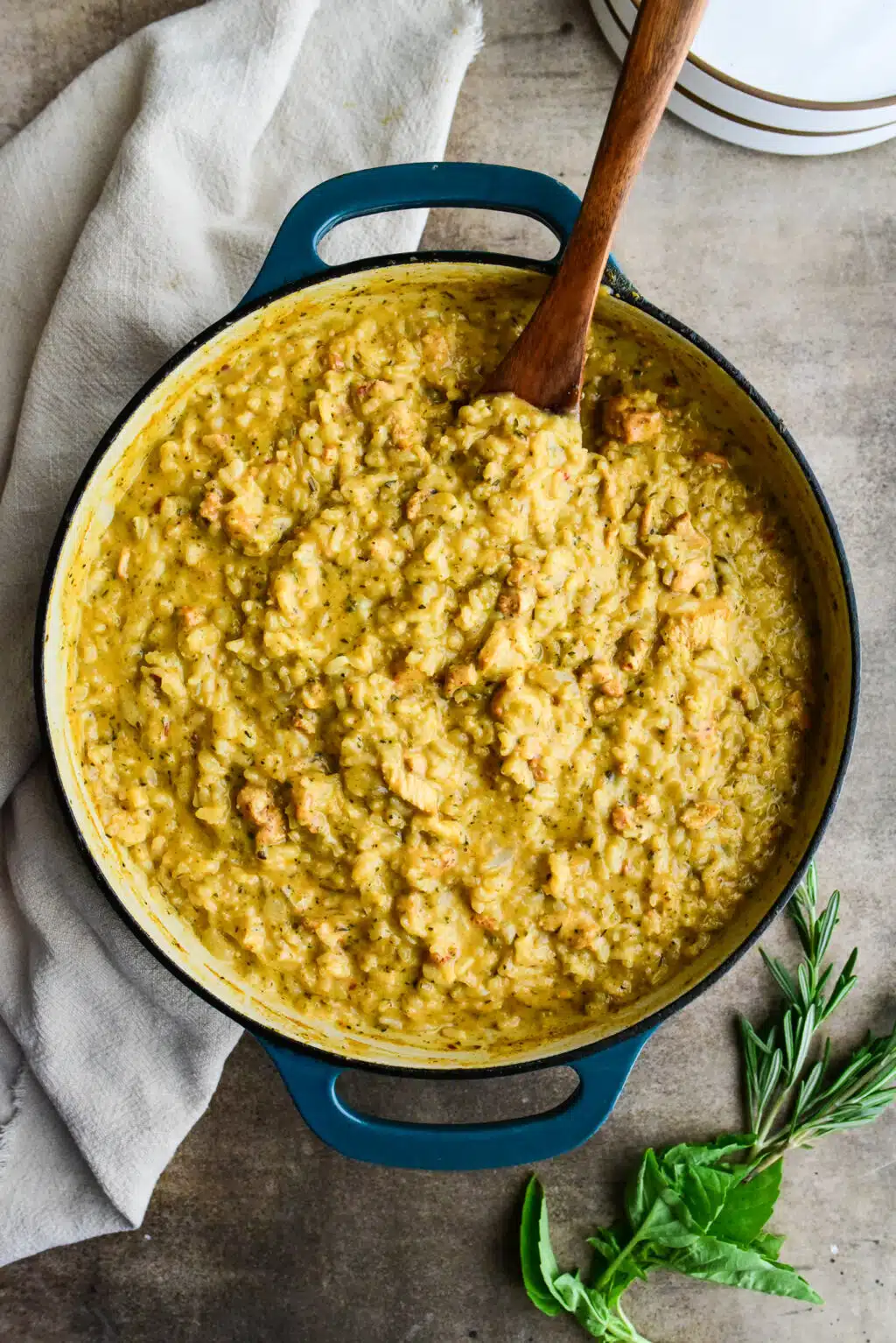 overhead shot of oven-baked chicken and herb risotto