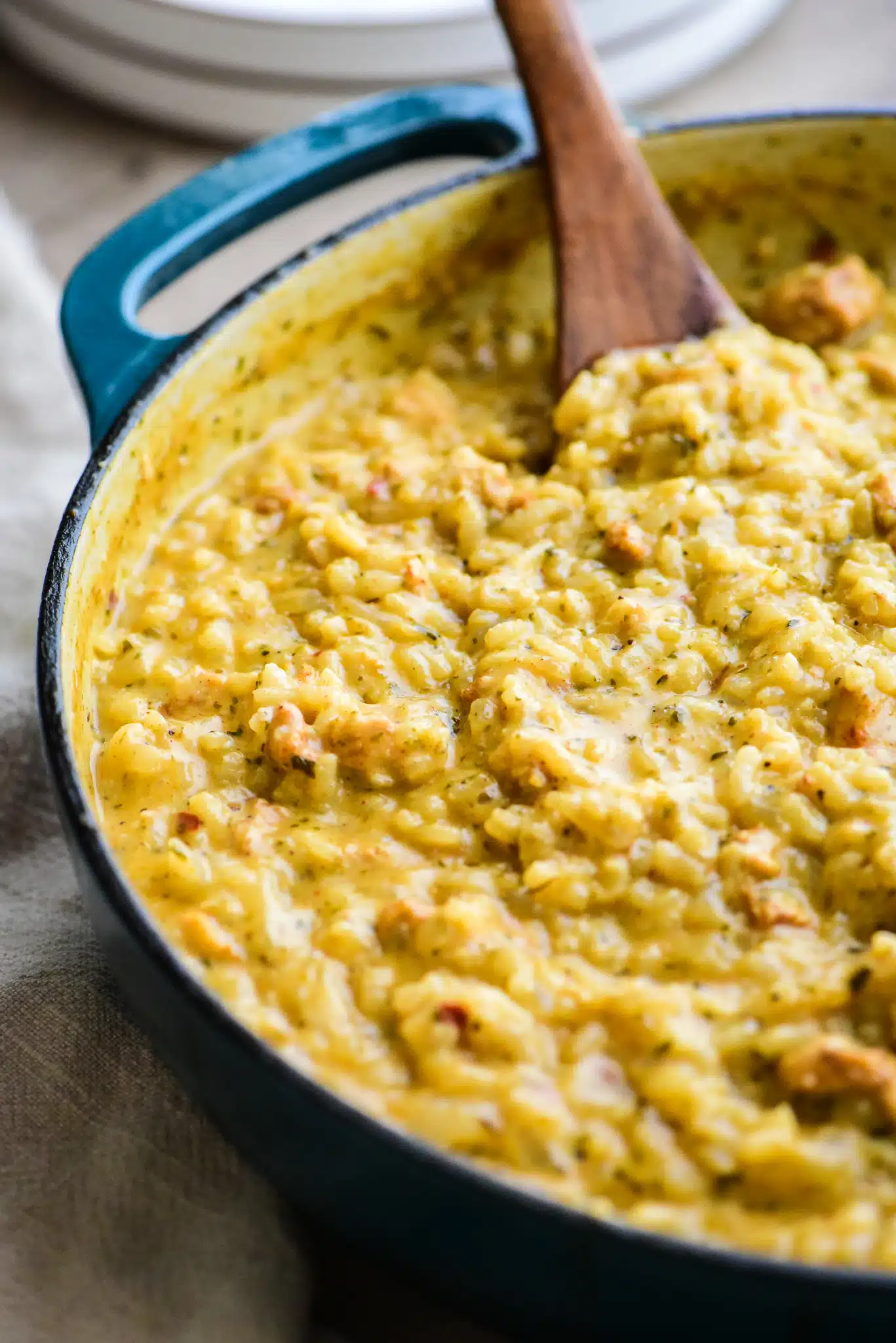close-up of oven-baked chicken and herb risotto in a large saucepan